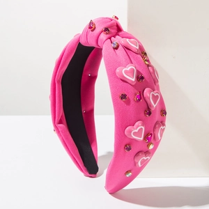 Stijlvolle roze geknoopte haarband met hartjes en fonkelende veelkleurige strassteentjes