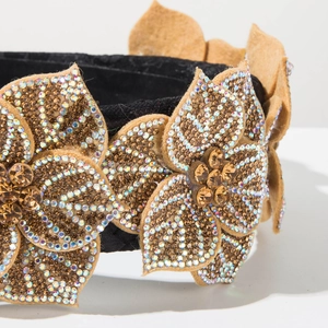 Detailed close-up of baroque floral headband with intricate crystal rhinestones