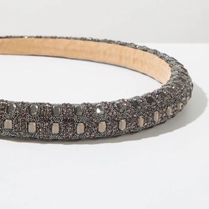 Macro shot of charcoal grey headband featuring full rhinestone inlay and soft lining