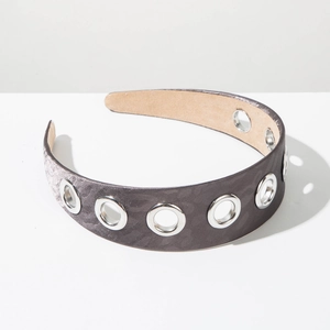 Close-up of wide retro headband with grey leopard texture and silver metal eyelet details