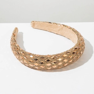 Detail of wide headband with champagne gold rhinestones and non-slip velvet lining