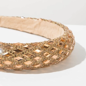 Macro shot of luxury wide headband with champagne crystals and soft velvet lining