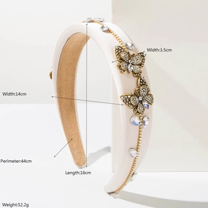 Elegant cream padded headband with gold crystal butterflies and sparkling rhinestones