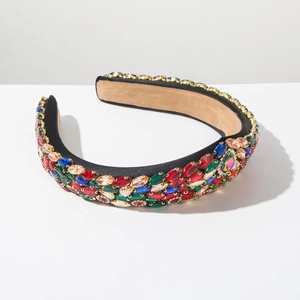 Detailed close-up of Baroque velvet headband with multi-colored rhinestones on white background