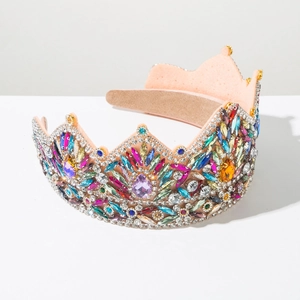 Macro detail of luxury baroque headband featuring colorful rhinestones and pink felt lining