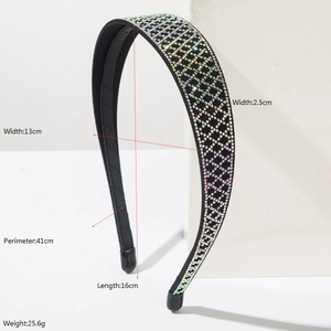 Luxury black headband with sparkling colorful rhinestones and geometric patterns on stand