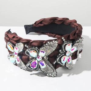 Detail of hand-woven brown wide headband with crystal-encrusted butterflies