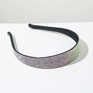 Close-up of sparkling multi-row AB rhinestones on thin headband with black soft protective tips