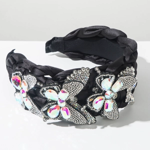 Detail of luxury braided headband featuring rhinestone butterflies and colored gems