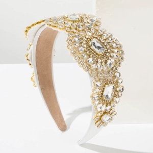 Detailed side view of luxury white baroque headband with clear crystals and gold prongs