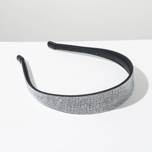 Detailed close-up of a sparkling silver rhinestone headband with black leather lining