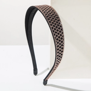 Detail view of headband with luxury pink rhinestones in a geometric cross pattern
