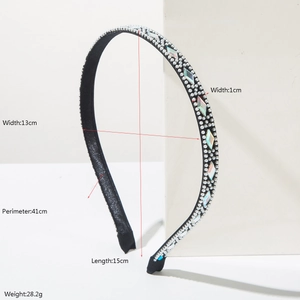 Elegant headband with white pearls and sparkling rhinestones on a slim black frame