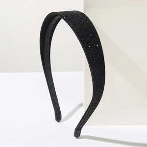 Detailed view of luxury black headband with full rhinestone diamond mesh and non-slip grip