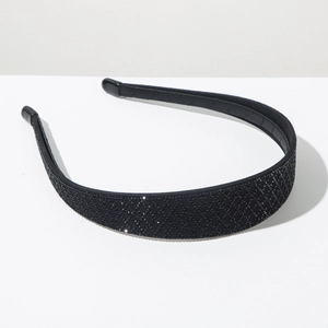 Detail view of black headband with full rhinestones in a luxury diamond lattice pattern