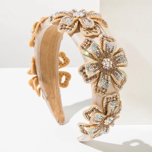 Sparkling wide headband with five rhinestones-encrusted flowers and champagne satin finish