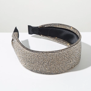Close-up of wide headband featuring dense sparkling silver rhinestones on black base