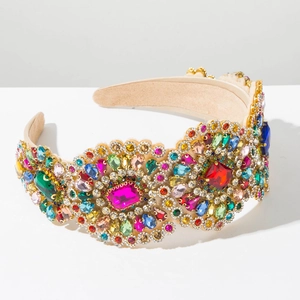 Macro shot of colorful rhinestones on a beige velvet baroque headband