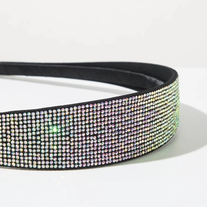 Macro shot of colorful rhinestones on a black headband with high-density inlay detail