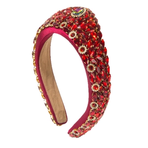 Baroque style wide headband with deep red crystals and gold metal details on white background