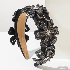 Detail of black floral headband featuring intricate grey rhinestones and sparkling crystals