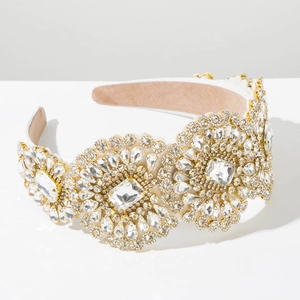 Macro detail of luxury baroque headband featuring intricate crystal sunburst flower patterns