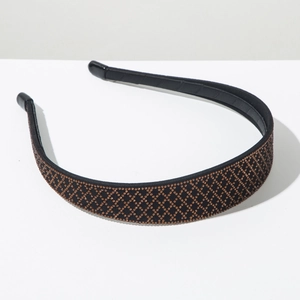 Detailed close-up of retro headband featuring brown rhinestones in a diamond lattice pattern
