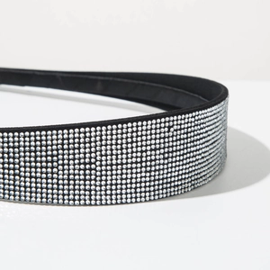 Detailed close-up showing the sparkling crystal rhinestones on a black velvet headband