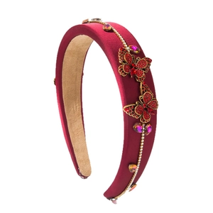Padded red velvet headband with 3D rhinestone butterflies and golden chain trim detail