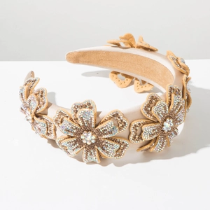 Vintage champagne padded headband featuring five handcrafted rhinestone flower decorations