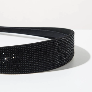 Close-up of sleek black rhinestone headband showing intricate sparkling details and texture
