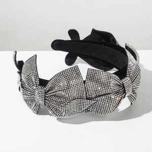 Elegant wide headband with sparkling rhinestones and oversized bow for evening parties