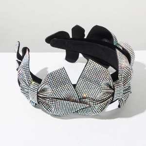 Detailed view of luxury wide headband with sparkling rhinestones and black velvet base