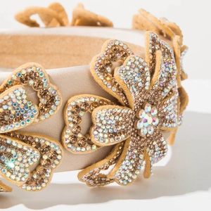 Macro detail of luxury floral headband with sparkling crystals and satin finish