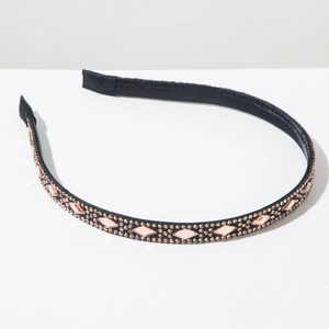 Detailed view of the black headband featuring sparkling pink crystals and champagne rhinestones