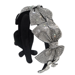 Luxurious velvet headband featuring multiple crystal encrusted bow ties in silver