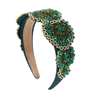 Luxurious Baroque emerald crystal headband with gold metal accents on green satin fabric