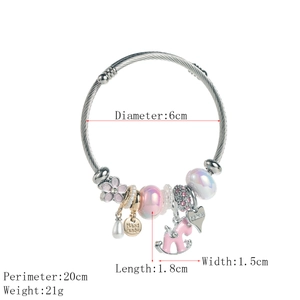 Silver beaded stainless steel bracelet with pink horse charms and adjustable band