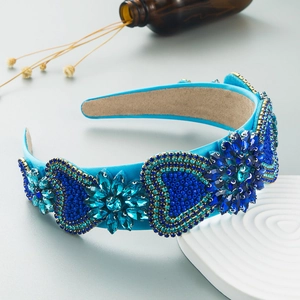 Detail of blue Baroque headband with rhinestones and beaded heart patterns