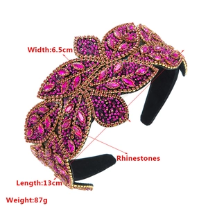 Detailed close-up of Baroque rhinestone leaf headband with beads and gold trim