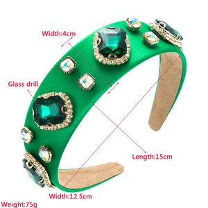 Close-up of green Baroque headband with large glass emerald stones and detailed dimensions