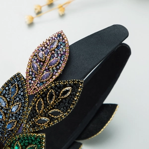 Detailed close-up of Baroque headband showing intricate beadwork and gemstone leaf patterns