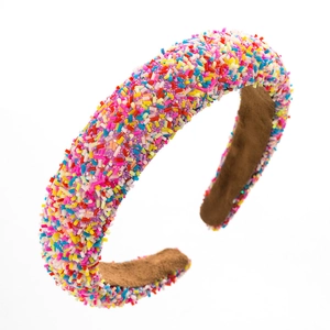 Fashionable wide headband with colorful sprinkle decorations and soft brown lining