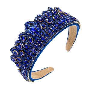 Baroque crown headband with navy blue crystals and gold chain trim on white background