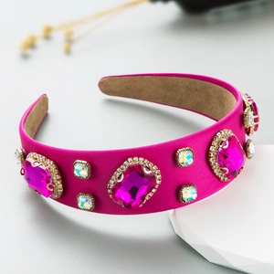Baroque hot pink velvet headband with large pink gemstones and crystals on grey background