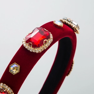 Baroque red velvet headband with crystal rhinestone embellishments and a luxury gemstone