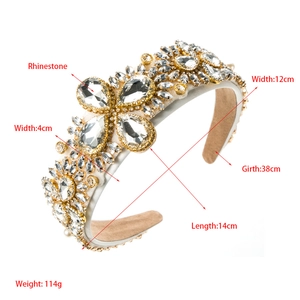 Detailed view of luxury baroque headband with clear rhinestones and golden floral accents