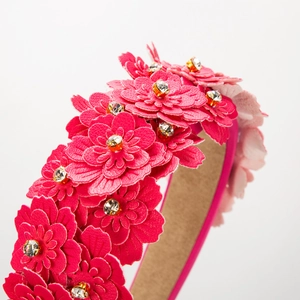 Baroque style headband featuring multilayer fuchsia flowers with sparkling rhinestone centers