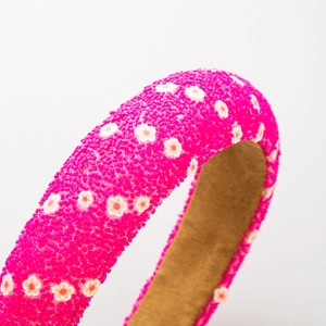 Pink beaded padded headband with floral pattern and soft velvet inner lining