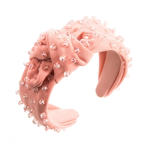 Pink fabric headband with twisted knot design and sparkling transparent beads for women